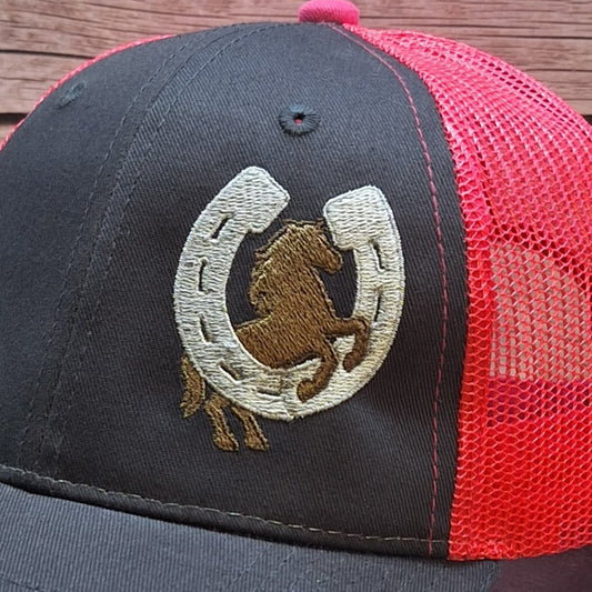 Trucker hat with red mesh back and gray front, featuring an embroidered horse and horseshoe design.