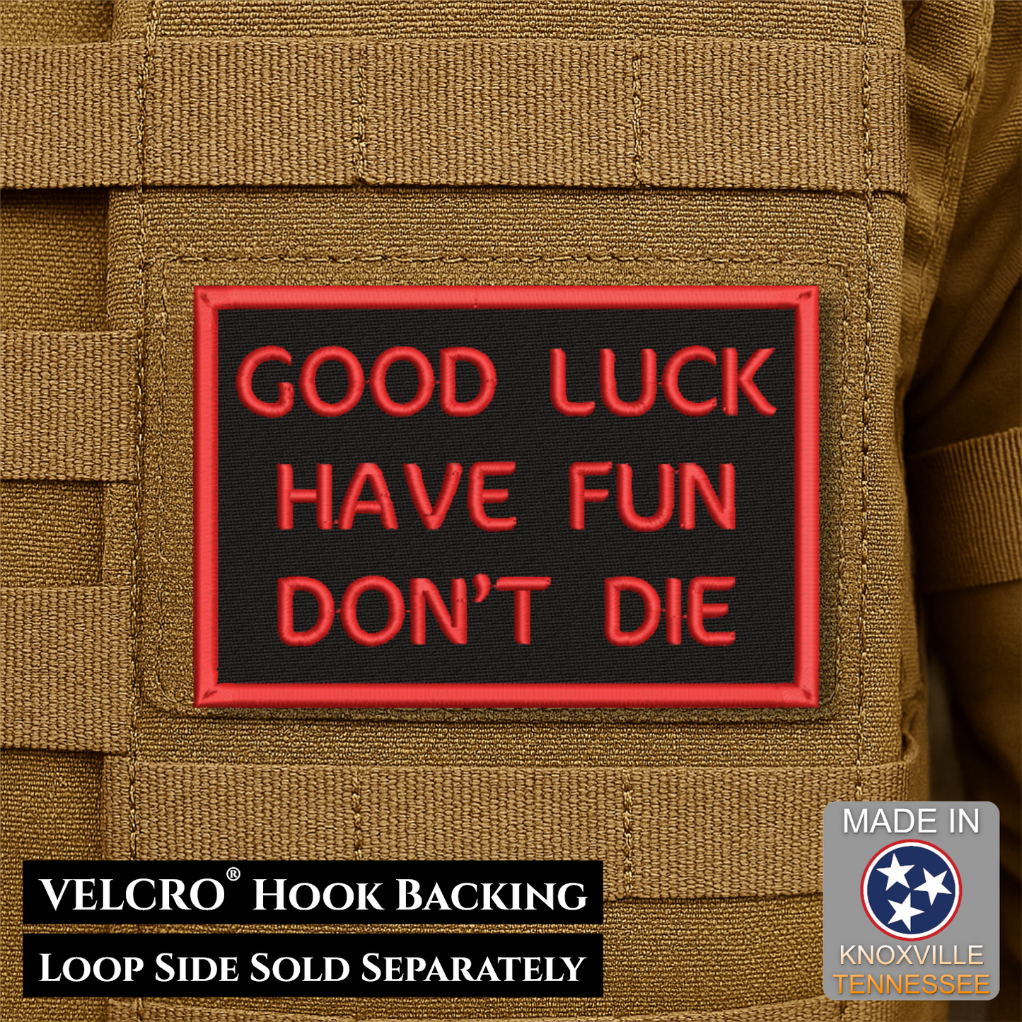 A rectangular black patch with red border and red text reading 'GOOD LUCK HAVE FUN DON'T DIE' attached to tan tactical gear. Text at the bottom says 'VELCRO HOOK BACKING LOOP SIDE SOLD SEPARATELY' and a 'Made in Knoxville Tennessee' badge appears in the lower right.