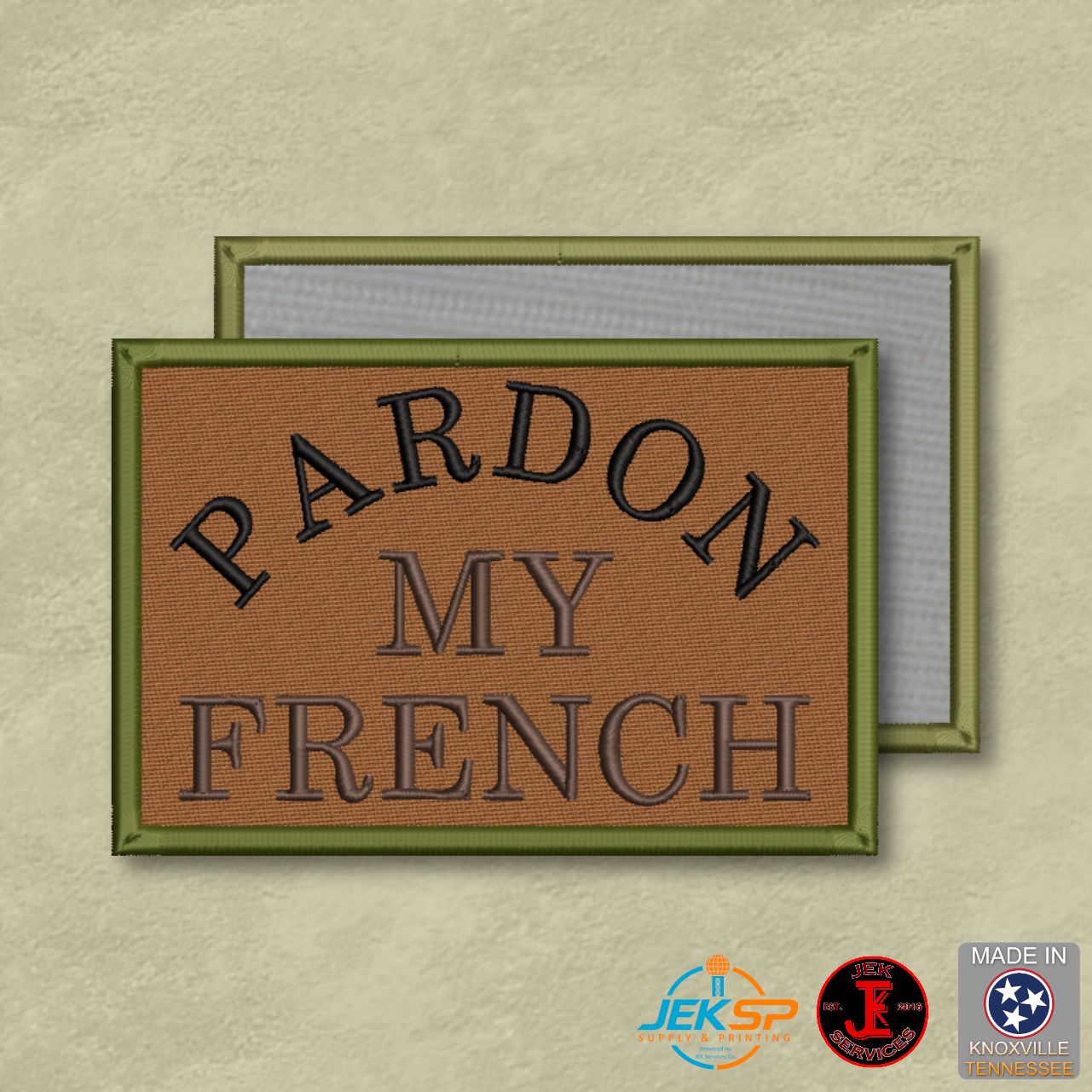 Pardon My French embroidered morale patch with black lettering on a brown background, green border, and Velcro® hook backing.