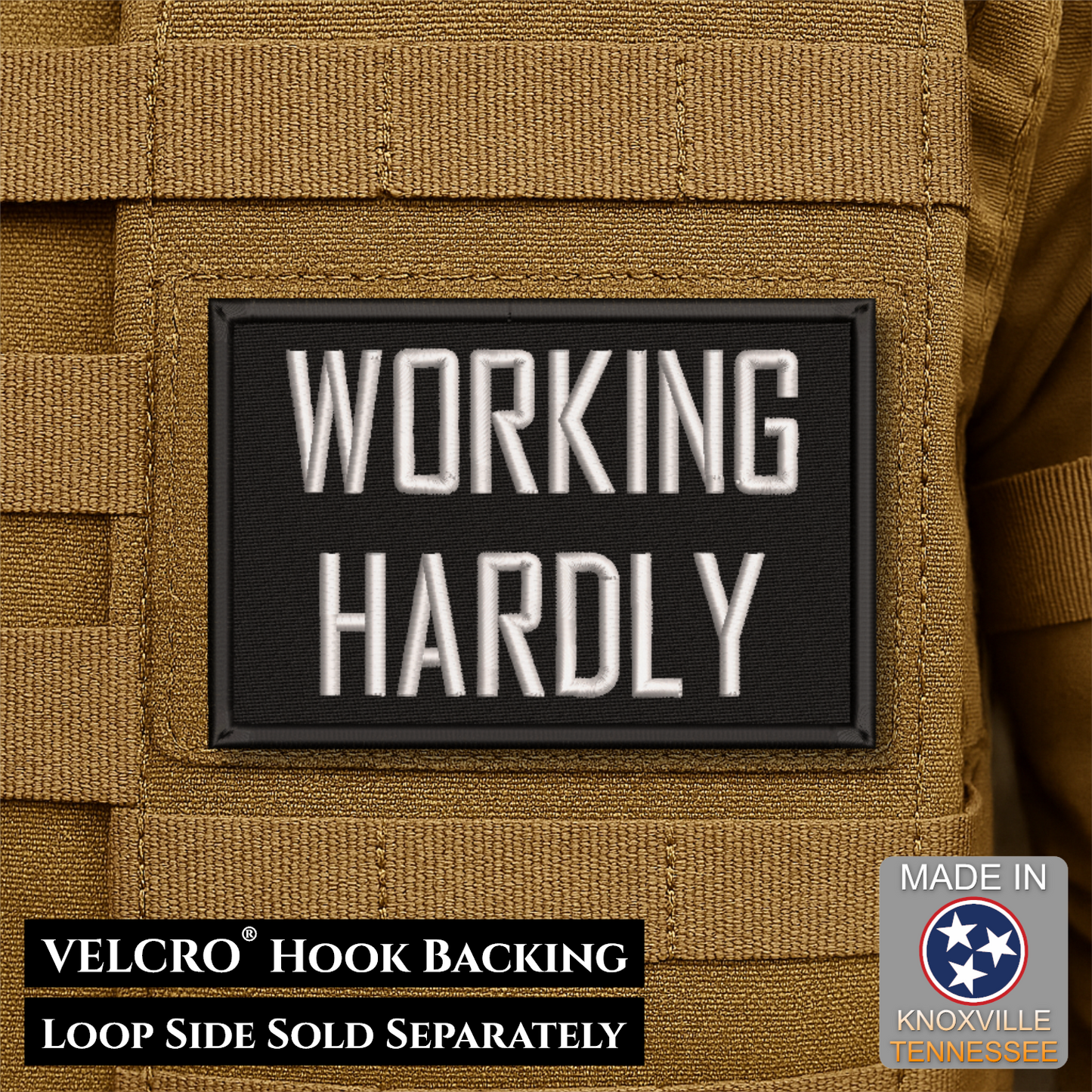 A rectangular black Velcro patch with raised white text reading 'WORKING HARDLY' mounted on tan tactical gear. Text at the bottom notes 'VELCRO HOOK BACKING' and 'LOOP SIDE SOLD SEPARATELY,' with a 'Made in Knoxville Tennessee' badge in the lower right.