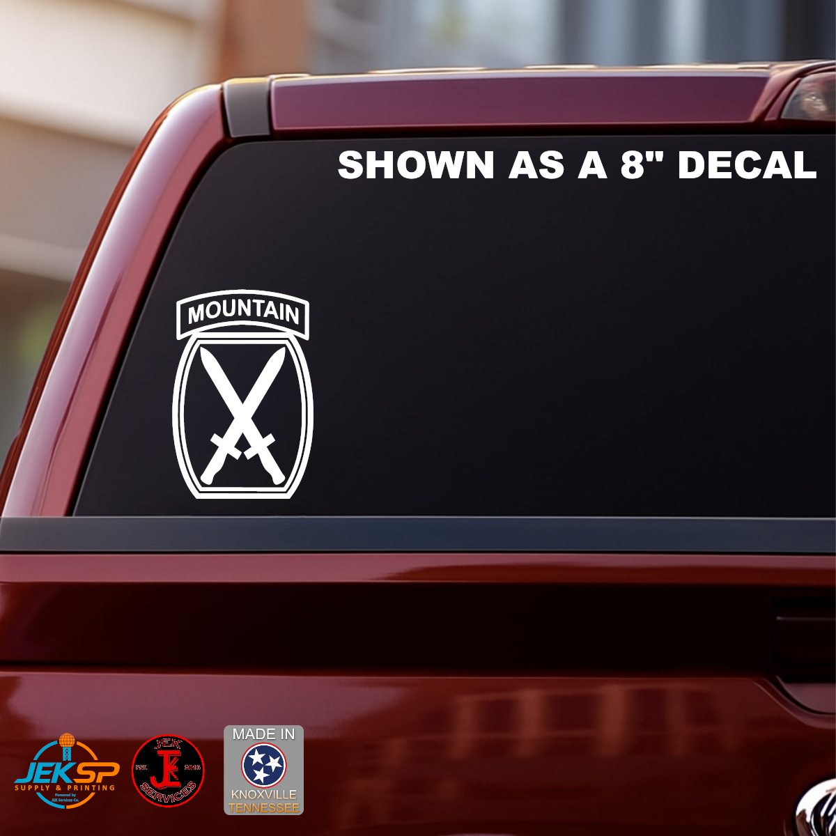 8 inch White 10th Mountain Division vinyl decal with Mountain tab and crossed swords insignia displayed on a truck rear window.