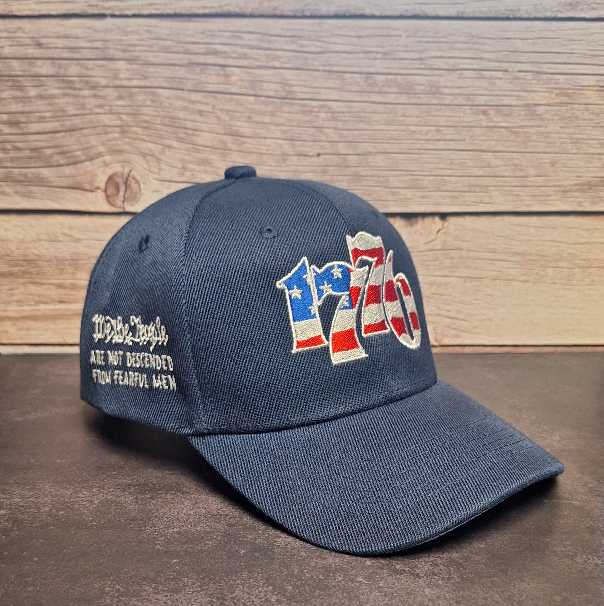 Blue cap with '1776' patriotic design with American flag lettering