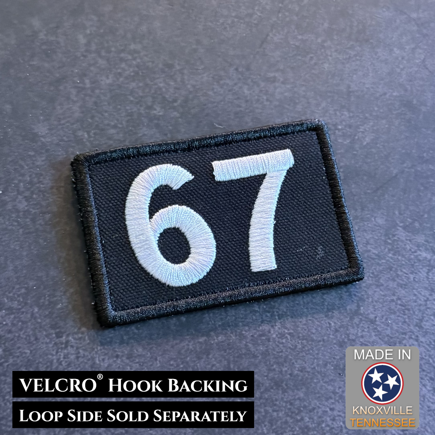 Black embroidered 67 morale patch with gray numbers and hook backing