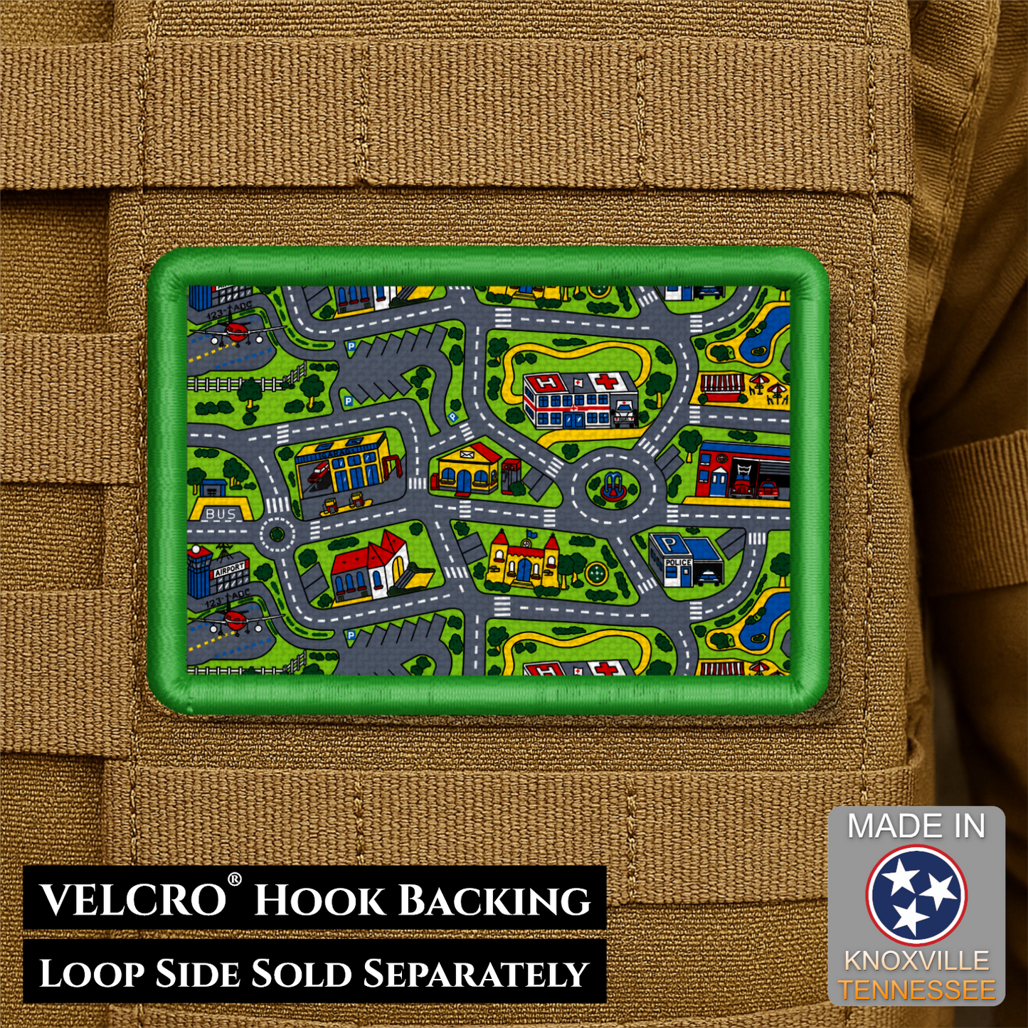 A rectangular Velcro patch with a colorful cartoon neighborhood map design, shown attached to tan tactical gear. Text at the bottom reads 'VELCRO HOOK BACKING LOOP SIDE SOLD SEPARATELY' and a badge says 'MADE IN KNOXVILLE TENNESSEE'.