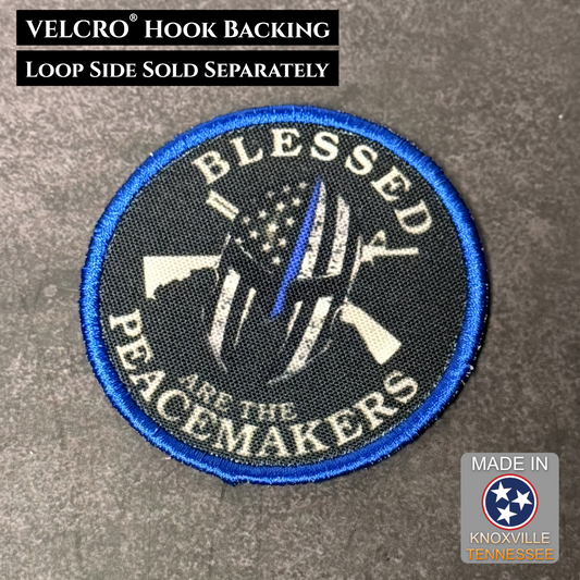 Patch with 'Blessed Are the Peacemakers' design on a gray background, featuring VELCRO hook backing.
