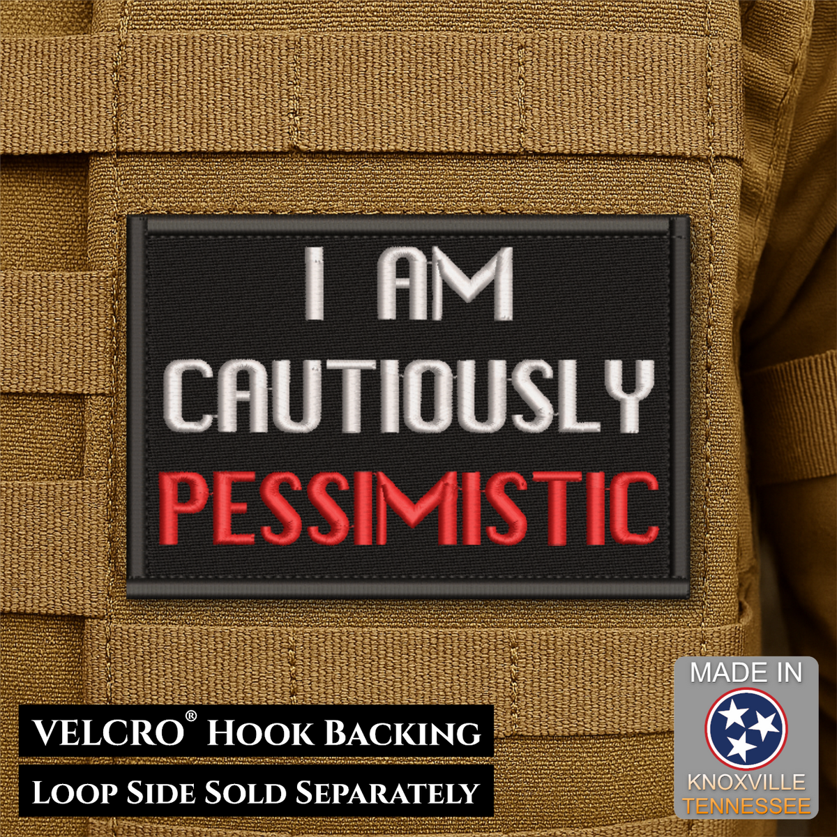A rectangular black Velcro patch with the text 'I AM CAUTIOUSLY PESSIMISTIC' in white and red lettering, shown attached to tan tactical gear. Text at the bottom notes VELCRO® Hook BACKING and LOOP SIDE SOLD SEPARATELY, with a Made in Knoxville Tennessee badge in the lower right.