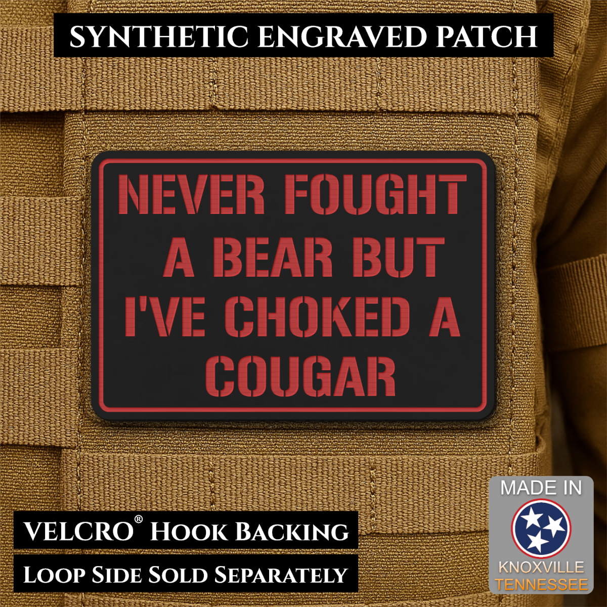 I’ve Choked A Cougar laser-engraved synthetic morale patch: a rectangular black synthetic patch with red border and red text reading “NEVER FOUGHT A BEAR BUT I’VE CHOKED A COUGAR,” shown attached to tan tactical fabric. Text.