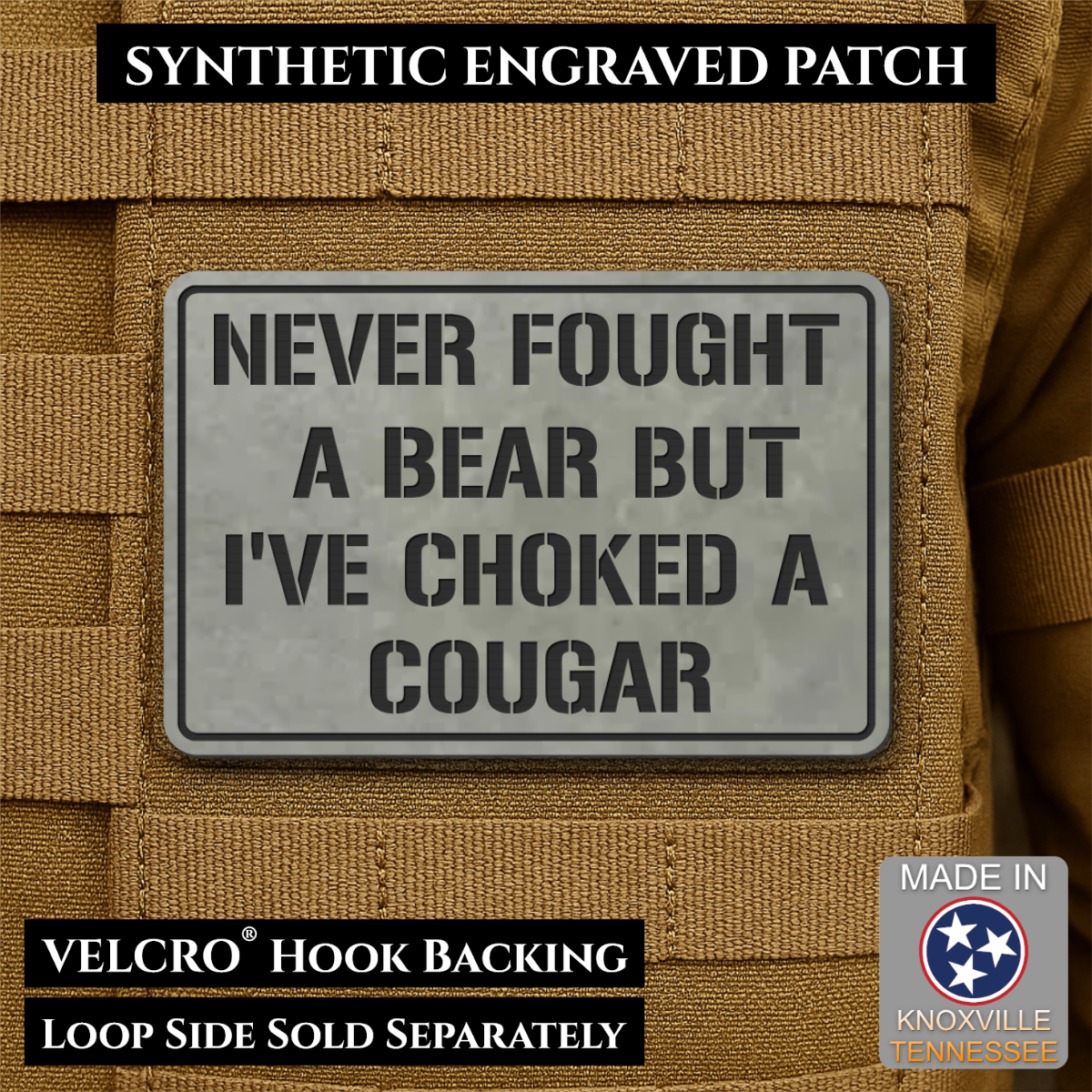 I’ve Choked A Cougar laser-engraved synthetic morale patch: a rectangular synthetic engraved patch with a gray background and black text reading “NEVER FOUGHT A BEAR BUT I’VE CHOKED A COUGAR,” shown attached to tan tactical.