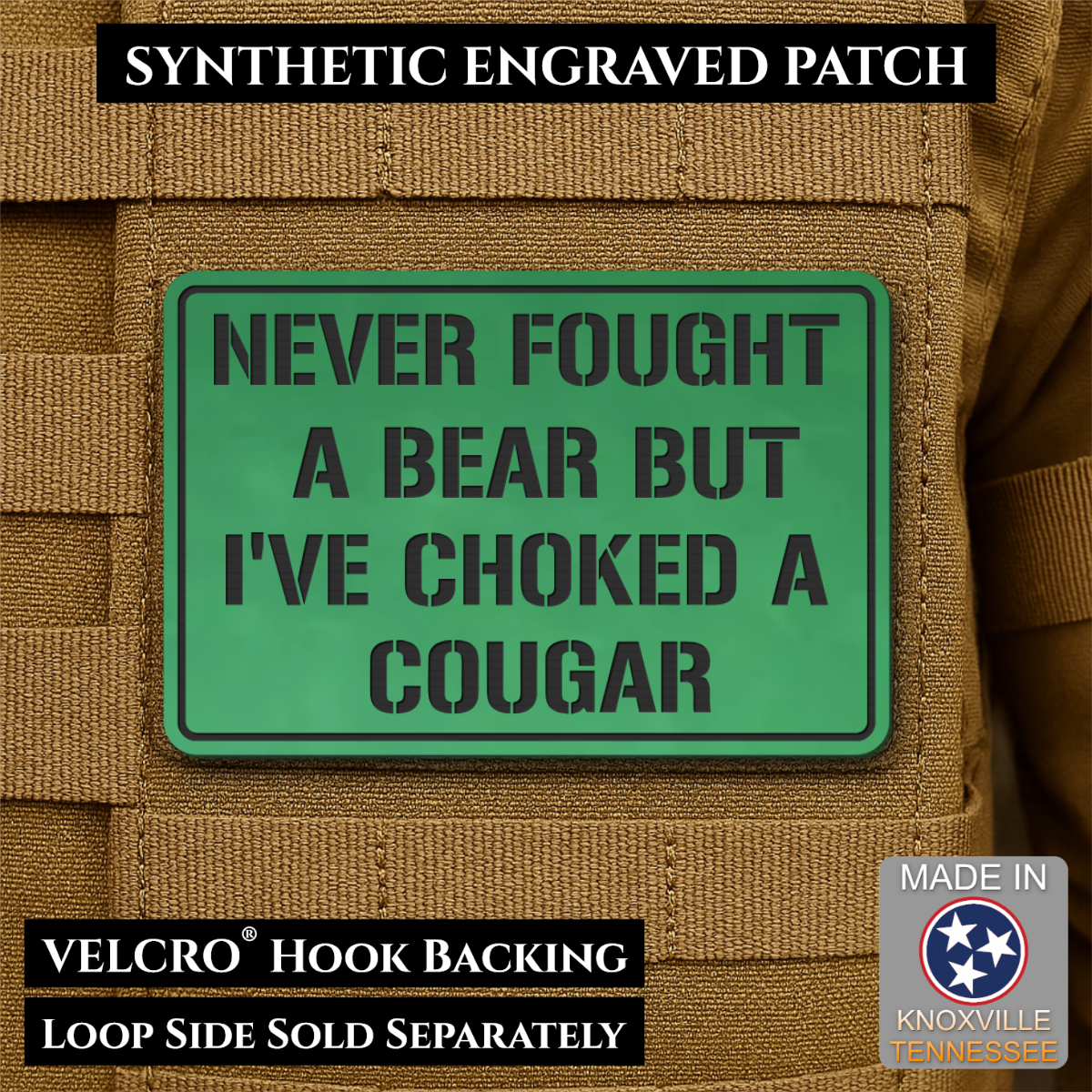I’ve Choked A Cougar laser-engraved synthetic morale patch: a green rectangular synthetic engraved patch with black text reading 'NEVER FOUGHT A BEAR BUT I'VE CHOKED A COUGAR' shown on tan tactical vest fabric. Black text banners.