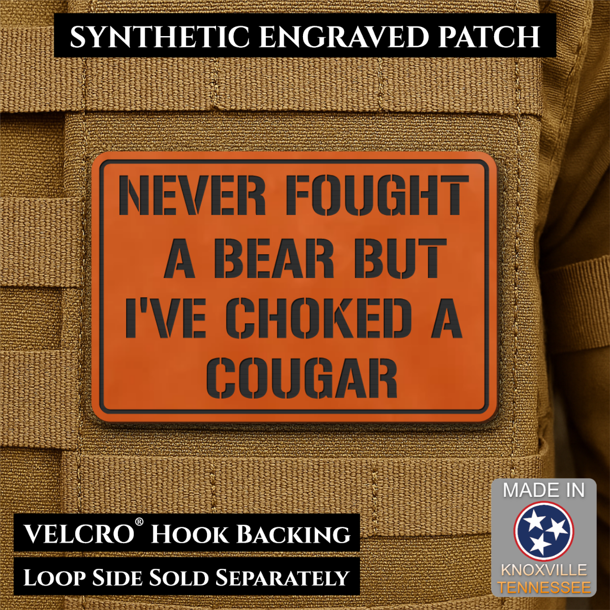 I’ve Choked A Cougar laser-engraved synthetic morale patch: an orange rectangular synthetic engraved patch with black text reading 'NEVER FOUGHT A BEAR BUT I'VE CHOKED A COUGAR' shown attached to tan tactical gear. Black text.
