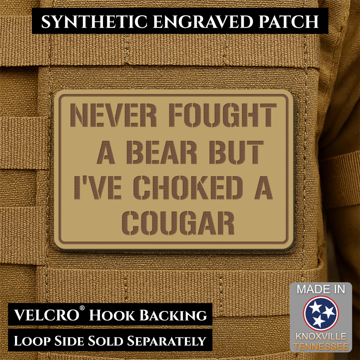 I’ve Choked A Cougar laser-engraved synthetic morale patch: a tan rectangular synthetic engraved patch with brown text reading 'NEVER FOUGHT A BEAR BUT I'VE CHOKED A COUGAR' shown on tan tactical webbing. Black text banners at the.