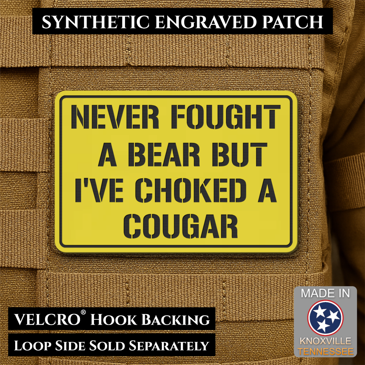 I’ve Choked A Cougar laser-engraved synthetic morale patch: a yellow rectangular synthetic engraved patch with black text reading 'NEVER FOUGHT A BEAR BUT I'VE CHOKED A COUGAR' shown attached to tan tactical vest fabric. Black text.
