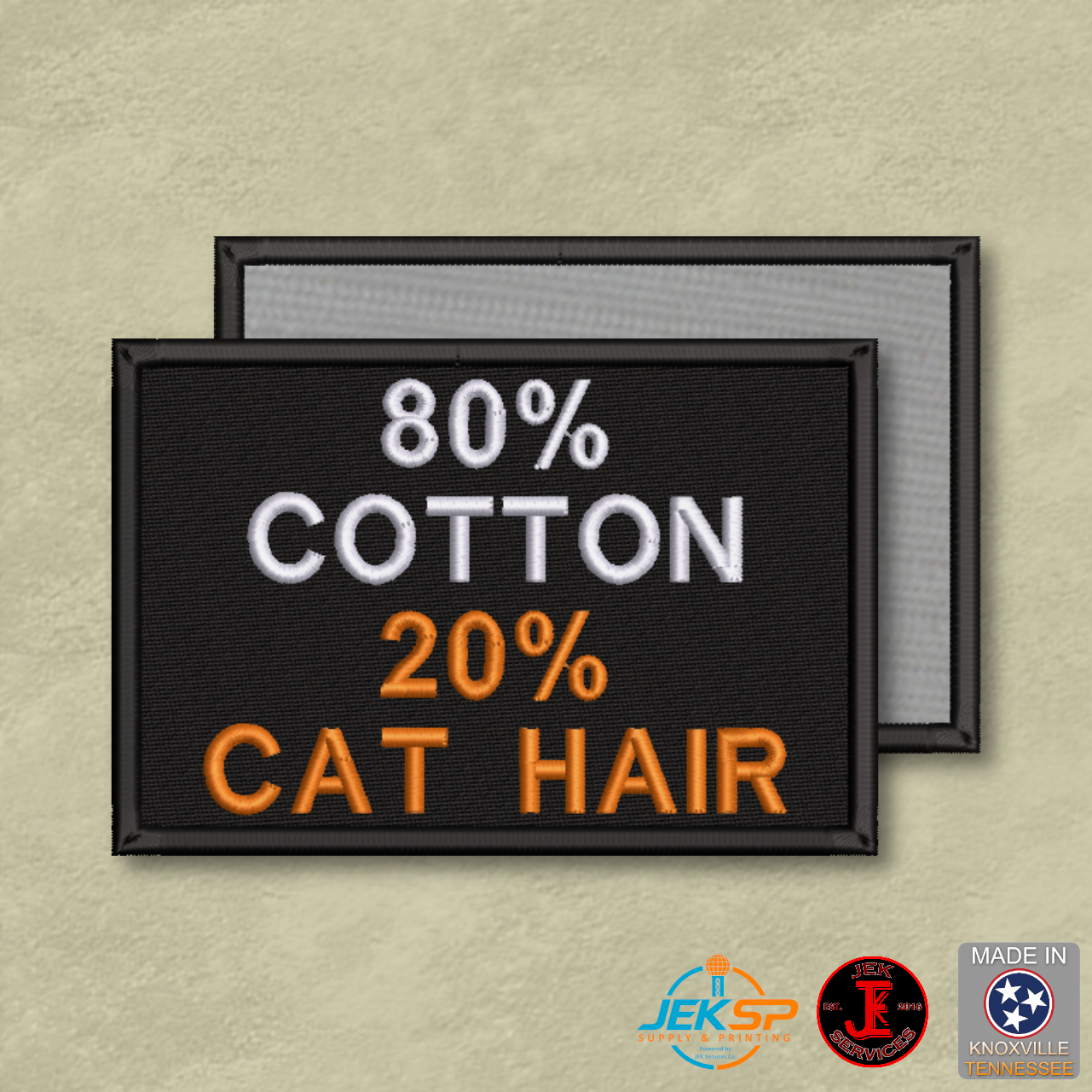 80% Cotton 20% Cat Hair funny embroidered morale patch with white and orange lettering on a black background and Velcro® hook backing.