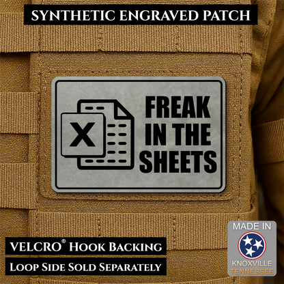 Gray laser engraved Freak in the Sheets morale patch featuring a spreadsheet icon and humorous office design