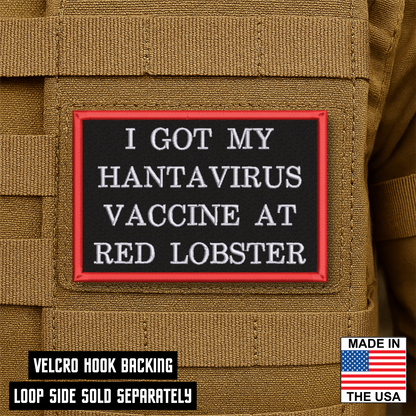 Black embroidered morale patch with white lettering reading "I Got My Hantavirus Vaccine at Red Lobster" and a red border attached to a tan tactical backpack.