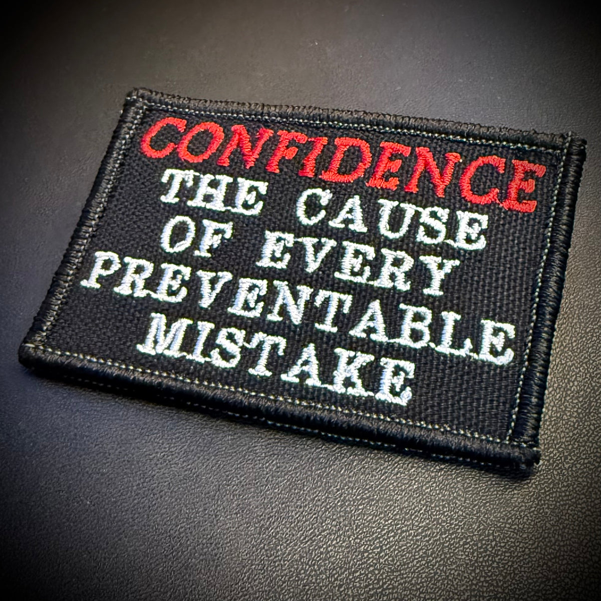Confidence Causes Mistakes Funny embroidered morale patch, product photograph.