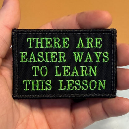Hard Life Lessons Funny Embroidered Morale Patch, 2x3" | VELCRO® Brand Hook Backing
