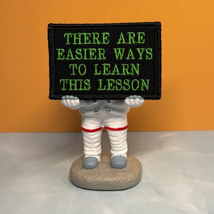 Hard Life Lessons Funny Embroidered Morale Patch, 2x3" | VELCRO® Brand Hook Backing