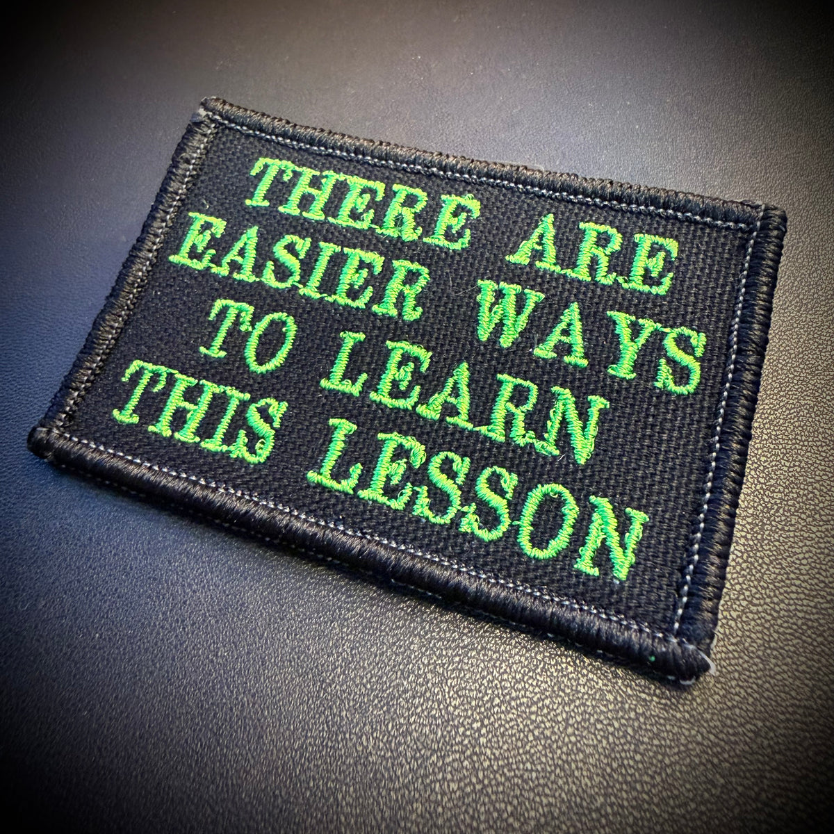 Hard Life Lessons Funny Embroidered Morale Patch, 2x3" | VELCRO® Brand Hook Backing