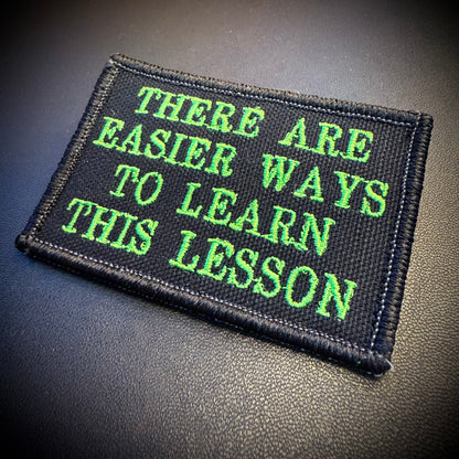 Hard Life Lessons Funny Embroidered Morale Patch, 2x3" | VELCRO® Brand Hook Backing