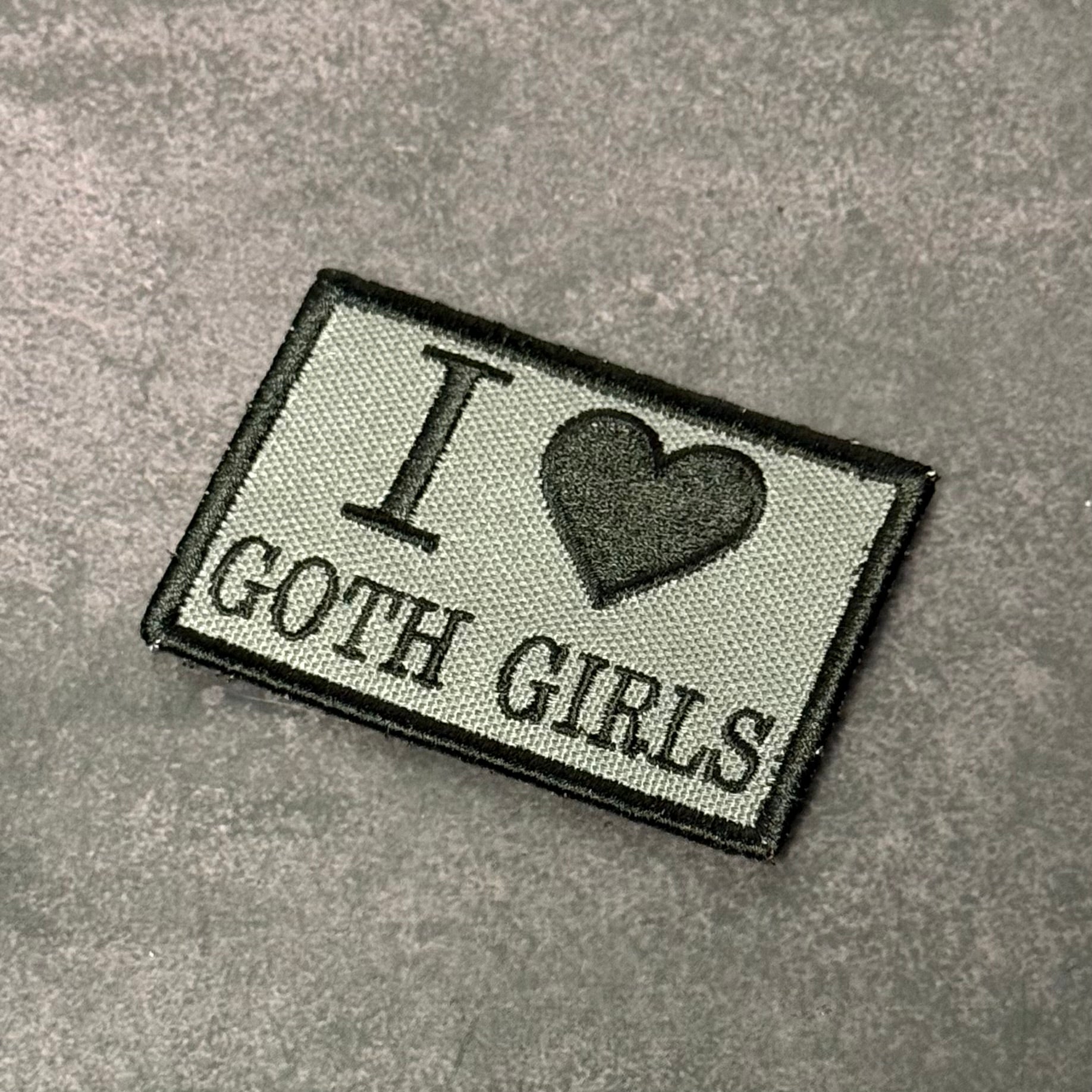 Gray embroidered morale patch with black border featuring the text "I Love Goth Girls" and a black heart symbol on a gray background.