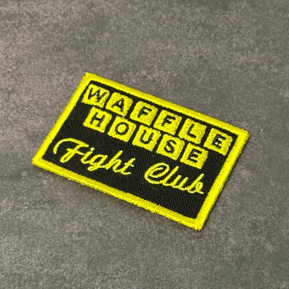 Black and yellow embroidered morale patch featuring the phrase "Waffle House Fight Club" in a design inspired by classic diner signage and internet meme culture.