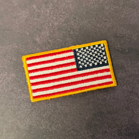 American flag patch on a gray background