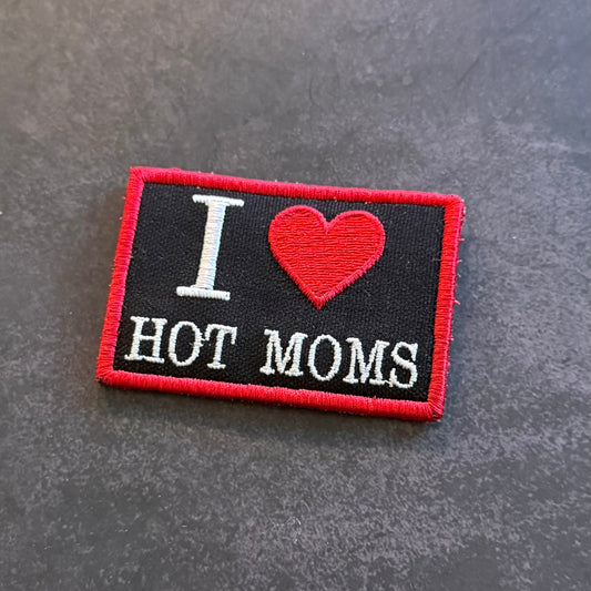 Black embroidered I Love Hot Moms morale patch with red heart design and red border