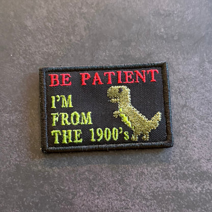 Embroidered Be Patient I'm From The 1900's morale patch featuring a dinosaur graphic and nostalgic humor