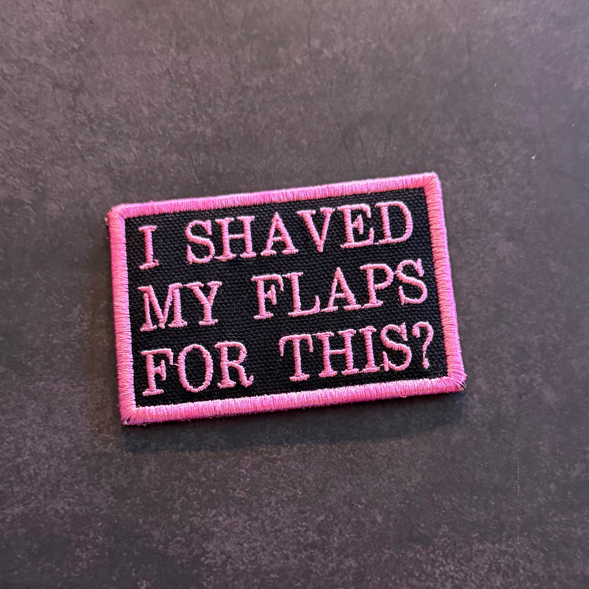 Pink and black embroidered I Shaved My Flaps For This funny morale patch with VELCRO hook backing