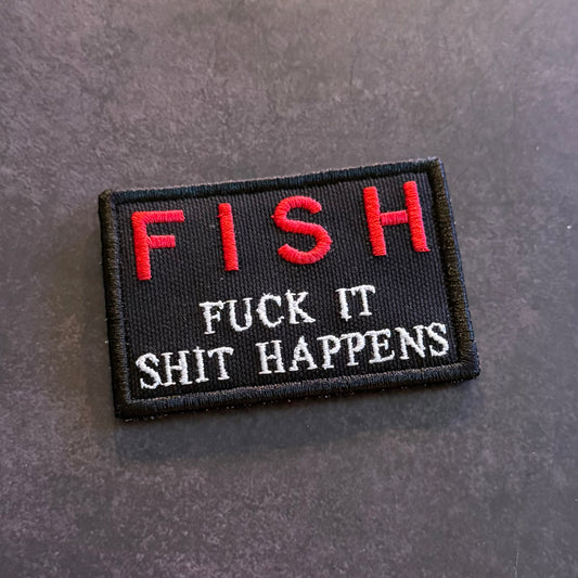 Black embroidered FISH Fuck It Shit Happens morale patch with red and white lettering and VELCRO hook backing