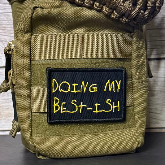 An olive green tactical pouch with a black rectangular patch featuring yellow embroidered text that reads 'DOING MY BEST-ISH'.