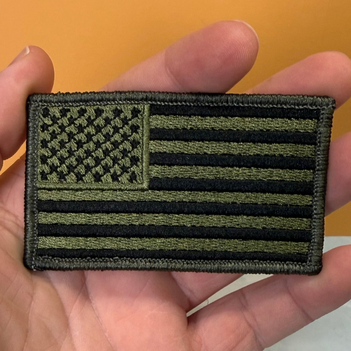 Olive OD Green Tactical American Flag embroidered morale patch, product photograph.