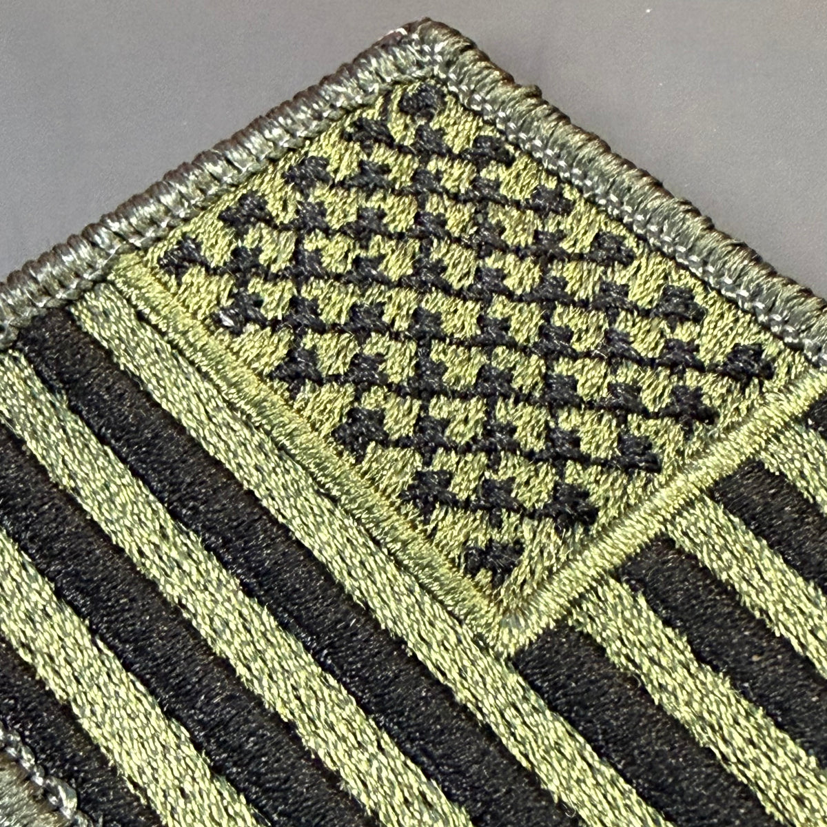 Olive OD Green Tactical American Flag embroidered morale patch, product photograph.