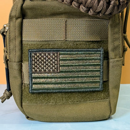 Subdued FDE Tactical American Flag embroidered morale patch: olive drab tactical pouch featuring a rectangular embroidered American flag patch in matching olive and brown tones, with a tan webbing strap and a brown paracord detail at the top.