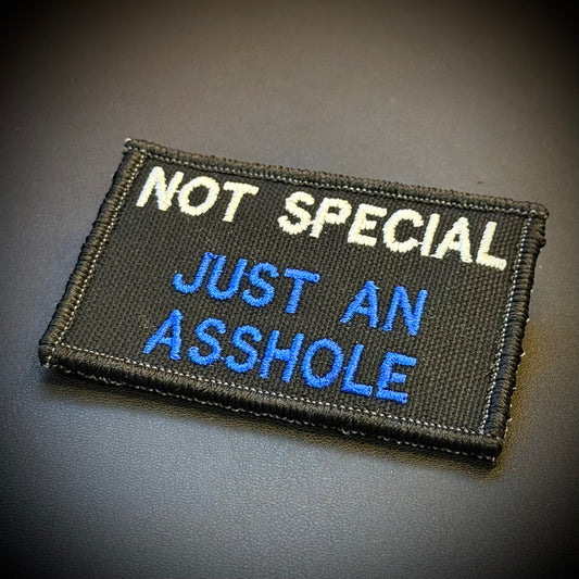 Not Special, Just An Asshole embroidered morale patch: with the text 'NOT SPECIAL JUST AN ASSHOLE' in white and blue on a black background.