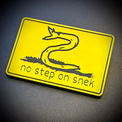 No Step On Snek laser-engraved synthetic morale patch, front view.