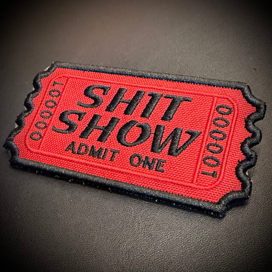 Welcome To The Shit Show Ticket embroidered morale patch: red and black embroidered patch shaped like a ticket with the words 'SHIT SHOW ADMIT ONE' 