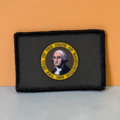 Washington State Flag printed canvas morale patch featuring the State of Washington seal with George Washington's portrait and a yellow border the design lettering.