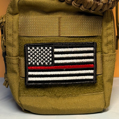 Thin Red Line American Flag Firefighter embroidered morale patch: pouch in olive drab green nylon with a black, white, and red embroidered 'Thin Red Line' American flag patch on the front pocket.