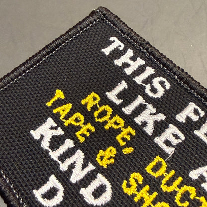 This Feels Like A Rope & Duct Tape Kind Of Day embroidered morale patch: black embroidered patch with white and yellow text reading 'THIS LIKE KIND' and 'ROPE, DUCK, TAPE, & SHIP' on a dark gray background.