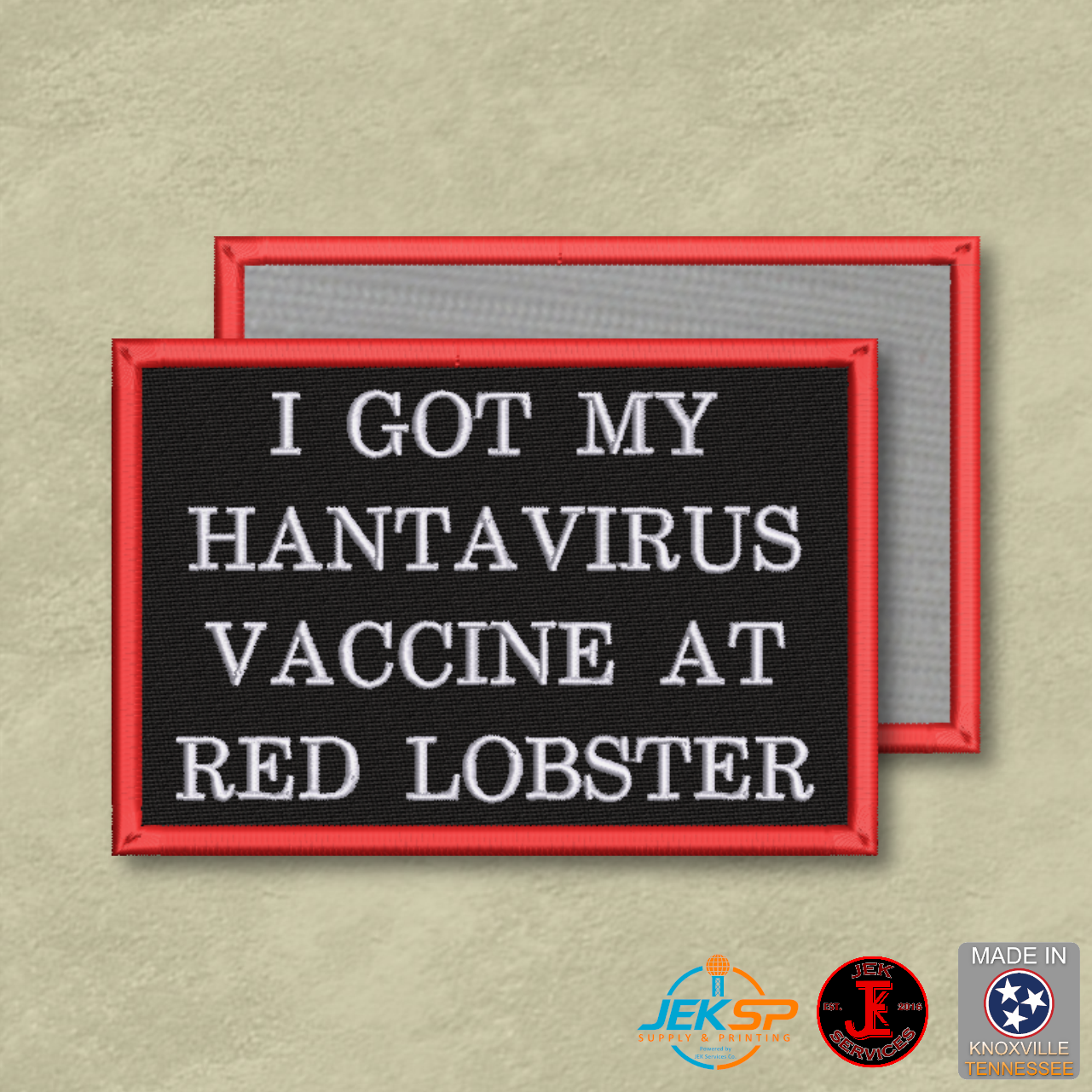Black embroidered morale patch with white lettering reading "I Got My Hantavirus Vaccine at Red Lobster" and a red border attached to a tan tactical backpack.