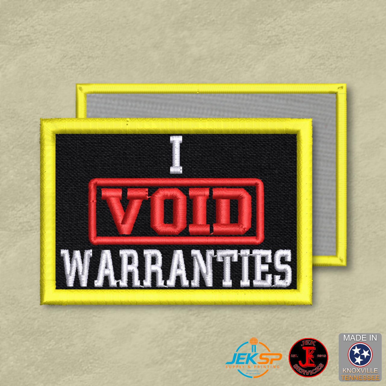 Black embroidered "I Void Warranties" morale patch with yellow border, red and white lettering, genuine VELCRO® hook backing, made in Tennessee.