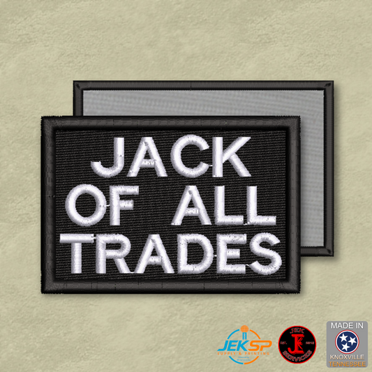 Black embroidered "Jack of All Trades" morale patch with white lettering, genuine VELCRO® hook backing, made in Tennessee.