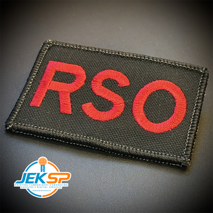 Range Safety Officer Patches & ID Plates – 2x3 Patch or 3x8 ID Panel – Tactical Gear embroidered or reflective range ID patch: black tactical patch with embroidered red letters spelling 'RSO' on a dark gray background. A JEKSP brand logo.