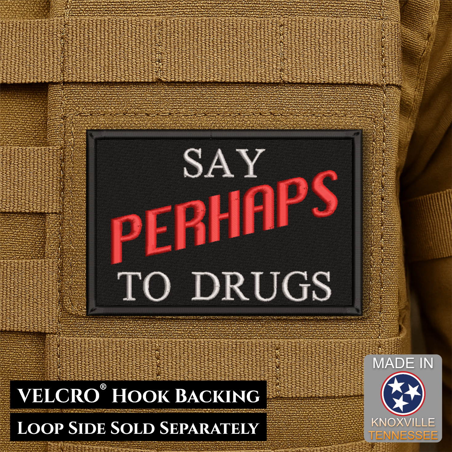 A rectangular black Velcro patch with the phrase “SAY PERHAPS TO DRUGS” in white and red embroidered lettering, shown attached to tan tactical fabric. Text at the bottom notes VELCRO™ Hook Backing and Loop Side Sold Separately; a “Made in Knoxville Tennessee” badge appears in the lower right.