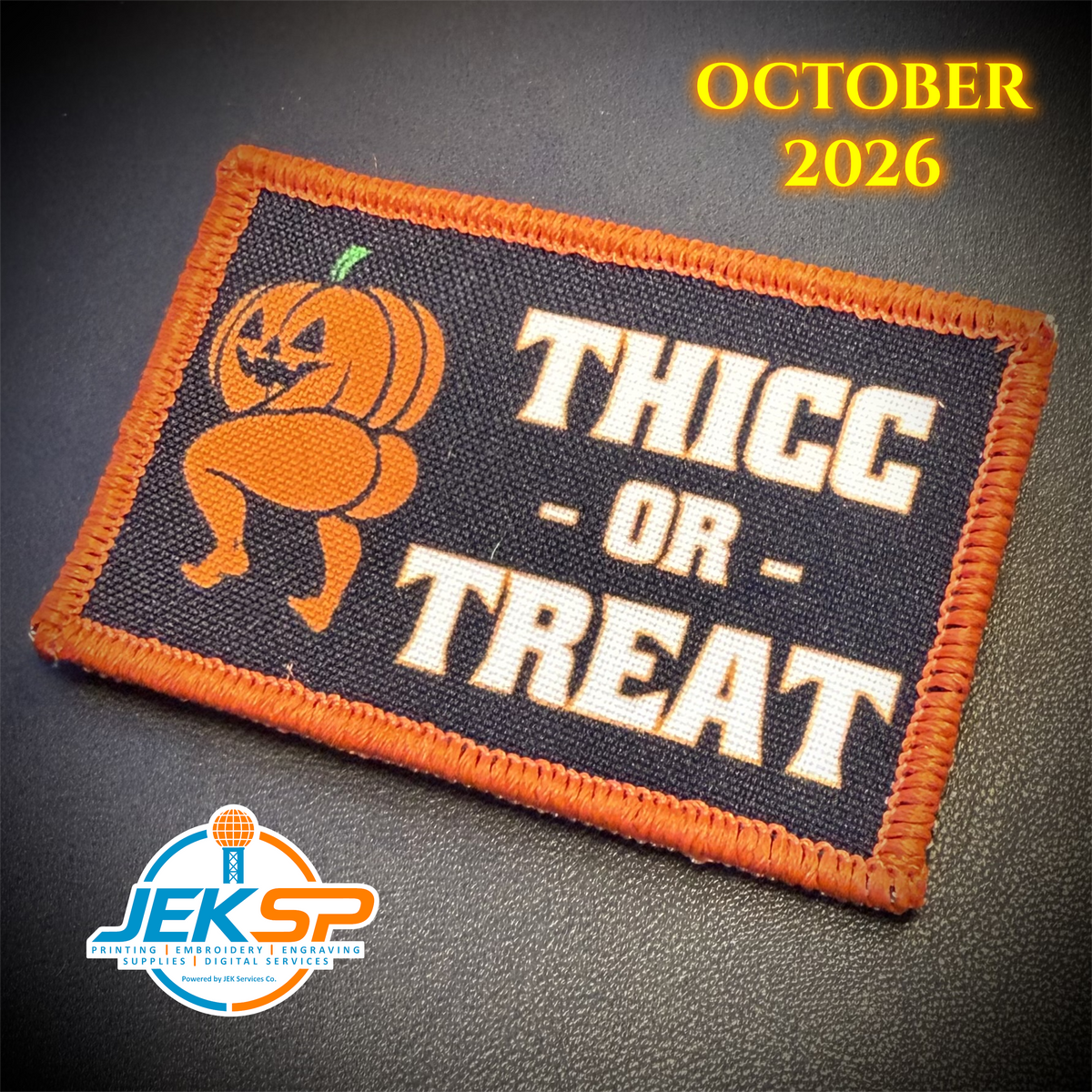 October 2026 Patch of the Month: Thicc or Treat Halloween pumpkin printed morale patch with an orange embroidered border.