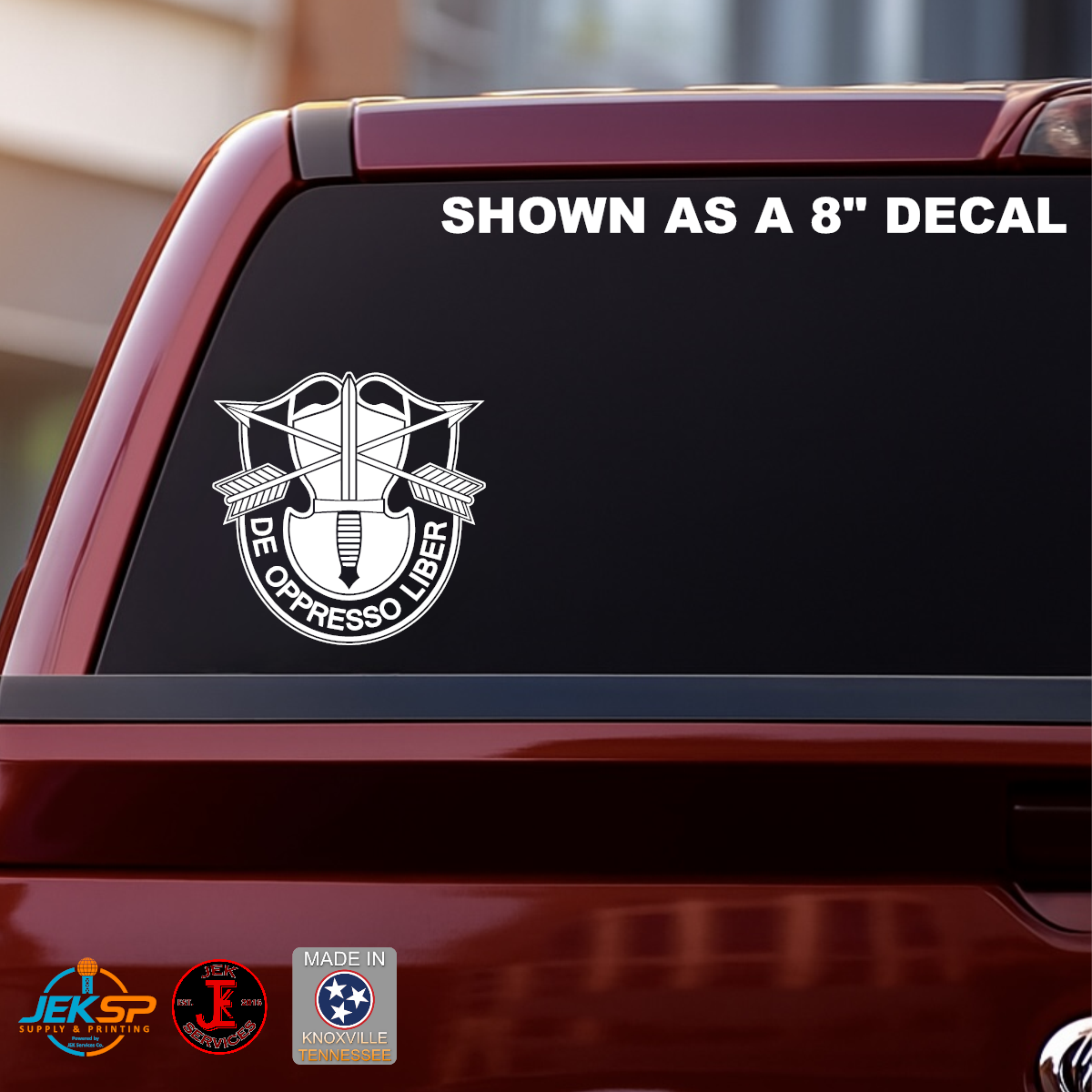 8 Inch White De Oppresso Liber Special Forces crest vinyl decal displayed on the rear window of a red pickup truck.