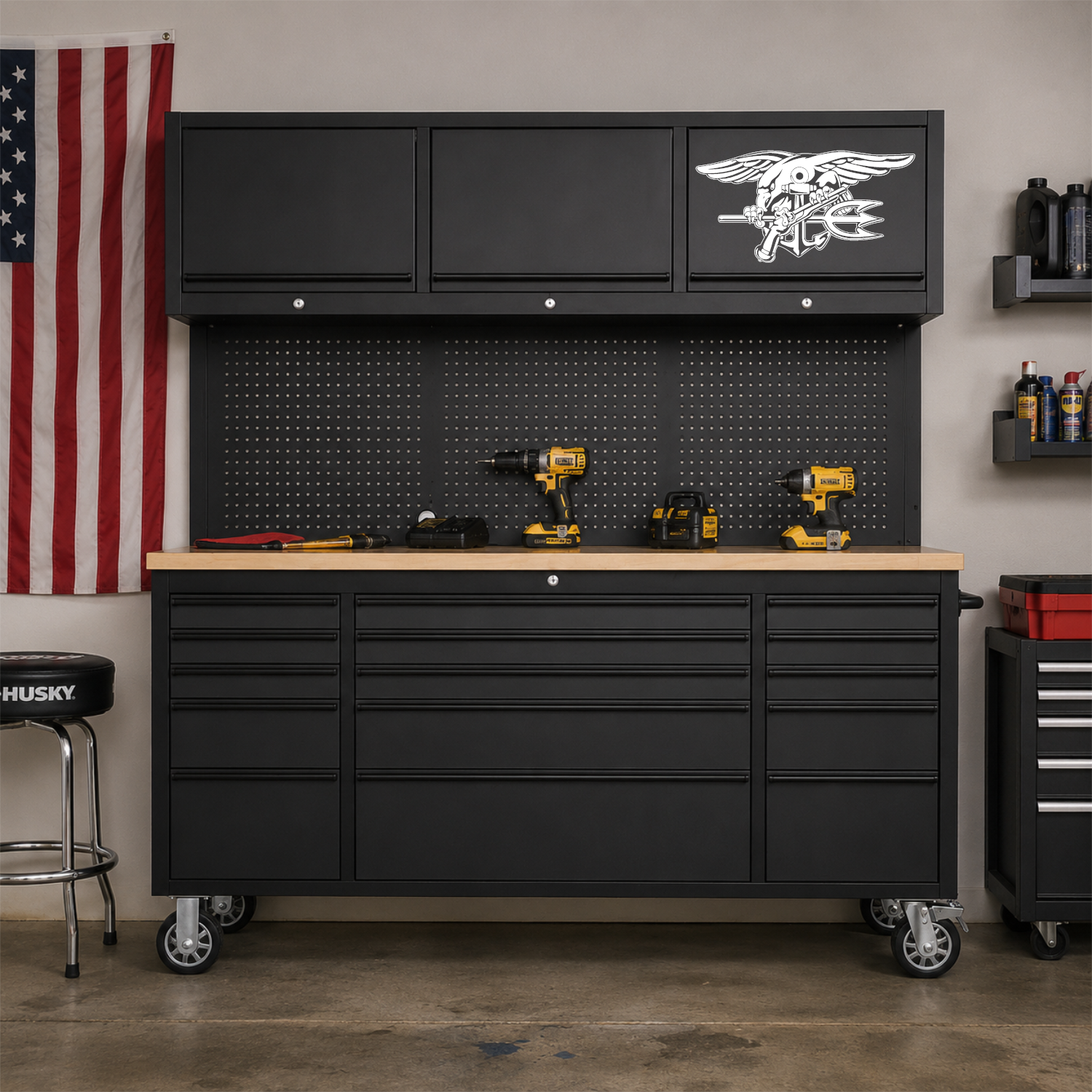 Navy SEAL Warfare Insignia on a black tool box in a garage.