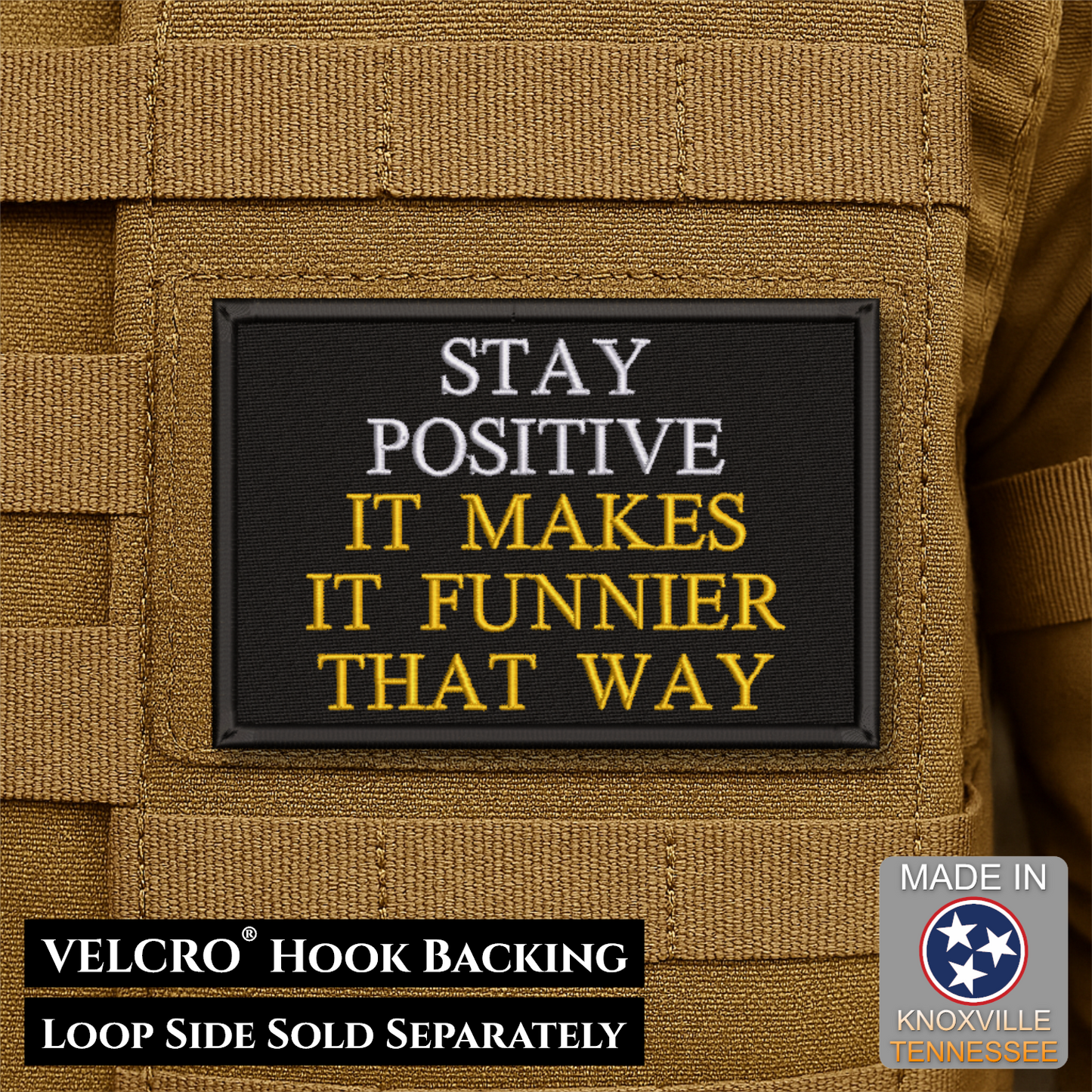 A rectangular black Velcro patch with embroidered text reading “STAY POSITIVE IT MAKES IT FUNNIER THAT WAY” in white and yellow, shown attached to tan tactical gear. Text at the bottom says “VELCRO HOOK BACKING LOOP SIDE SOLD SEPARATELY,” and a “MADE IN Knoxville Tennessee” badge appears in the lower right.